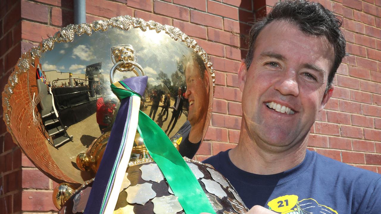 New Norwood coach Jade Sheedy with the Thomas Seymour Hill premiership trophy following Woodville-West Torrens’ 2021 SANFL grand final win against Glenelg. Picture: Dean Martin