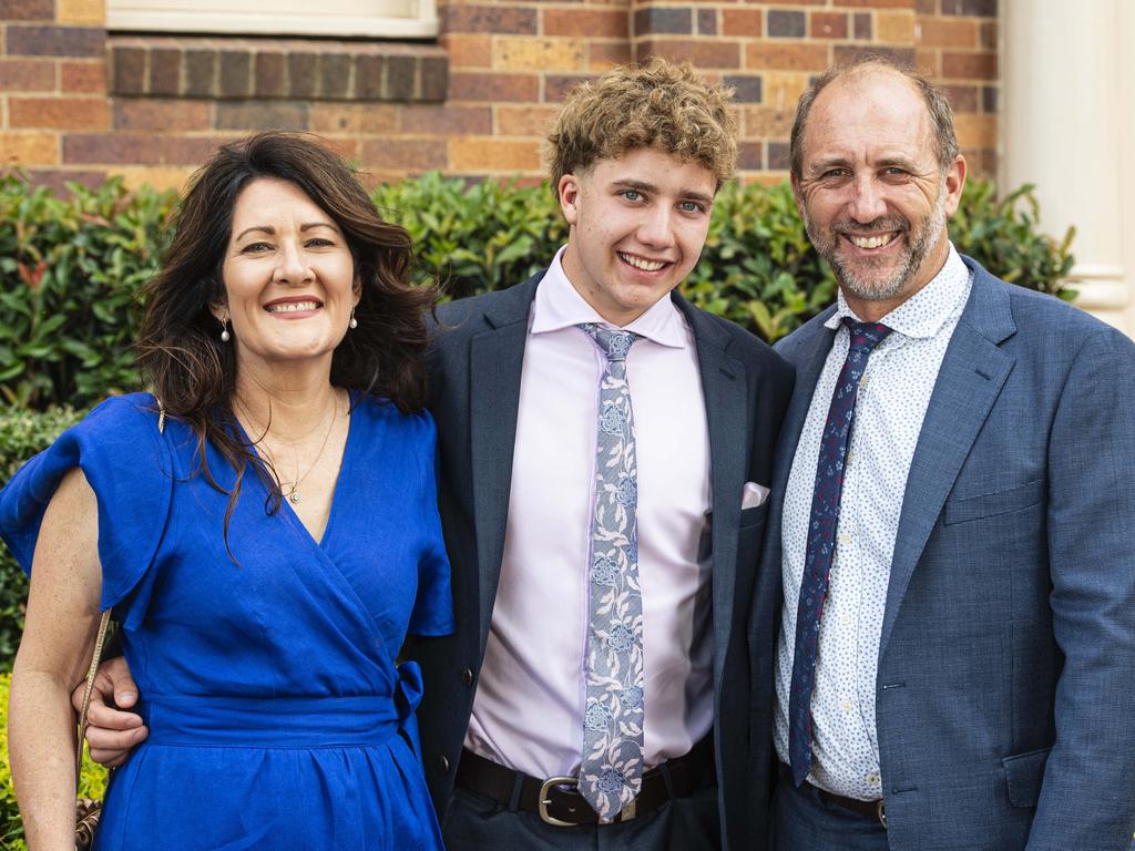 Graduate Hugh Lyndon with mum Michelle Tully and dad Jeff Lyndon as Downlands College year 12 students come together for their valedictory mass at the college, Saturday, November 16, 2024. Picture: Kevin Farmer