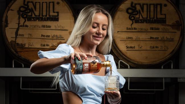 Jacinta Skuse with Sunshine &amp; Sons new rum "Nil Desperandum". Picture: Brad Fleet