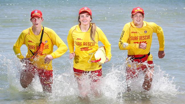 SA surf life savers Jess Welch with Henry Jenkin and Ryan Searle are ready for a hot, busy weekend. Picture Sarah Reed