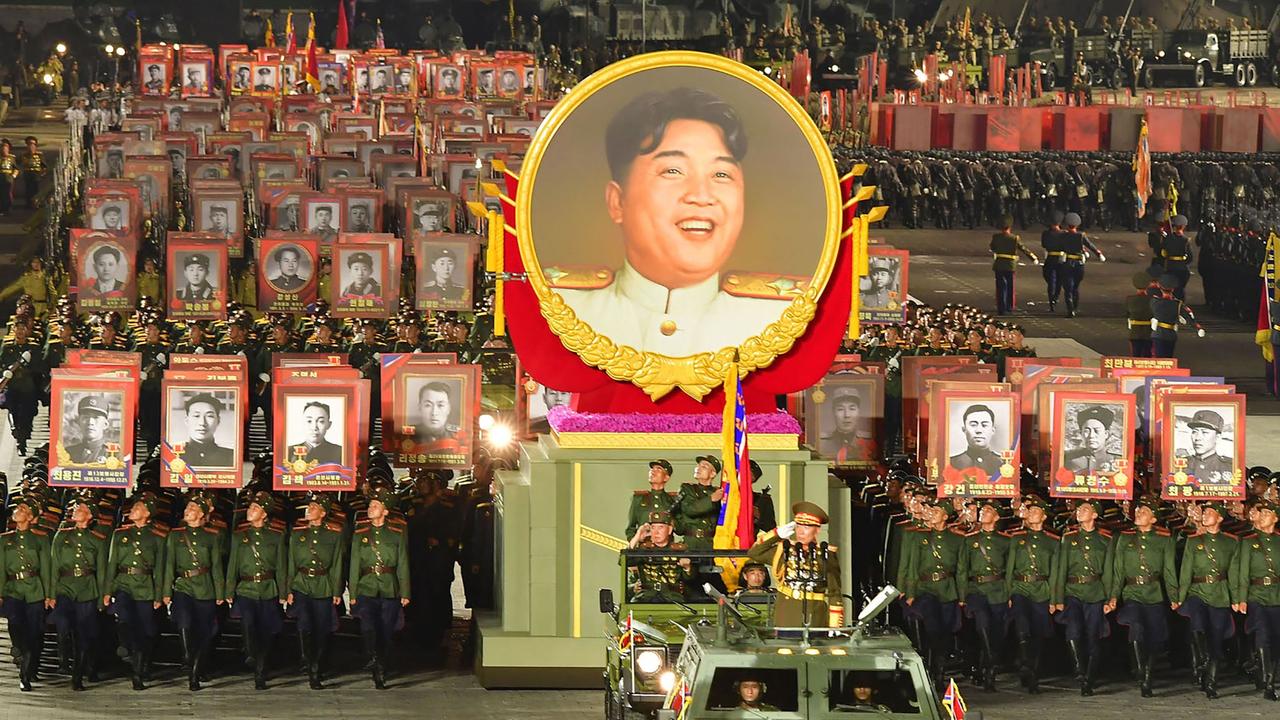 A huge image of Kim Jong-un is wheeled through Kim Il Sung Square in Pyongyang on June 28. (Photo by KCNA VIA KNS / AFP).