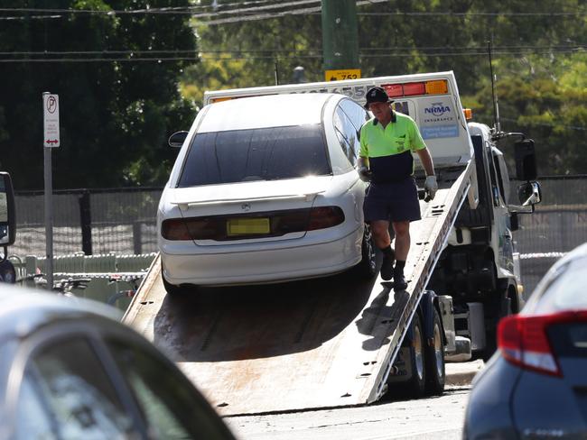 The assailant’s vehicle being towed away from outside Quakers Hill police station.