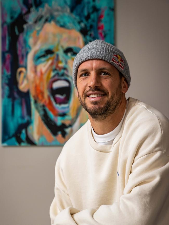 Port Adelaide football star Travis Boak with the painting of him done for SALA. Picture: Tom Huntley