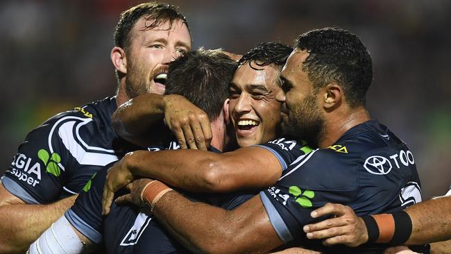 Michael Morgan celebrates with teammates after scoring a try to win the match against the Dragons. Picture: Getty Images