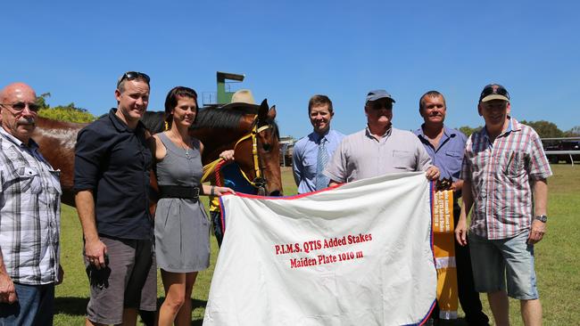 Effigy Belle took out first place in the QTIS Added Stakes Maiden Plate 1010m first day for the day. Pictured with some proud owners John Bight, Glen Hurney, Lacey Bathe, Mareeba Turf Club president Wes King, Barry Smart and Geoff Smith. Photo: Andrea Falvo.