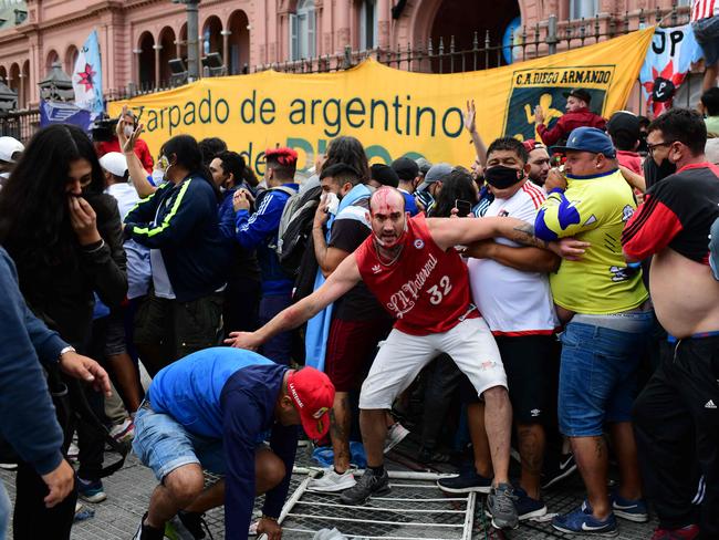 Fans outside the presidential palace.