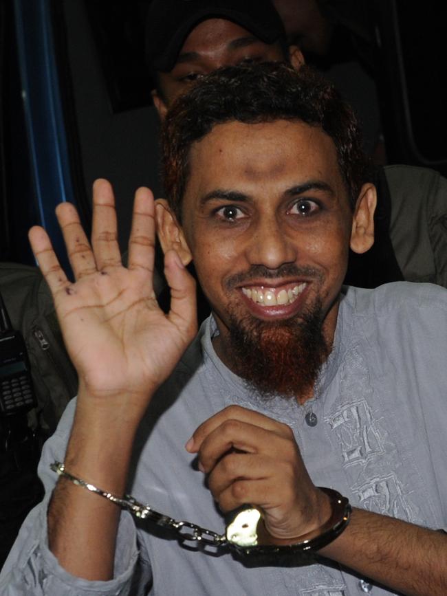 Indonesian militant Umar Patek arrive in handcuffs at Jakarta court on April 19, 2012, following his arrest. Picture: AFP