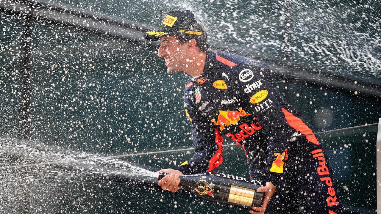 Race winner Daniel Ricciardo ocelebrates on the podium during the Formula One Grand Prix of China.