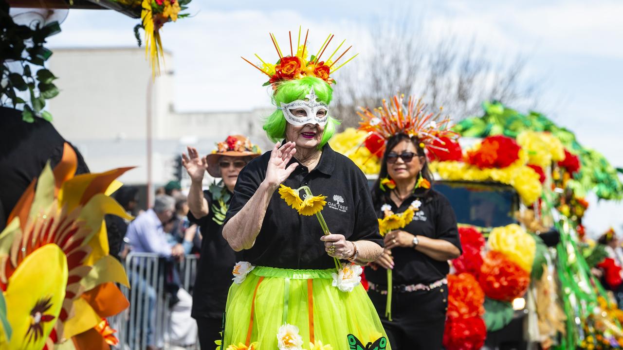 Sheila Davis walks with the Oak Tree Retirement Villages float Grand Central Floral Parade of Carnival of Flowers 2022, Saturday, September 17, 2022. Picture: Kevin Farmer