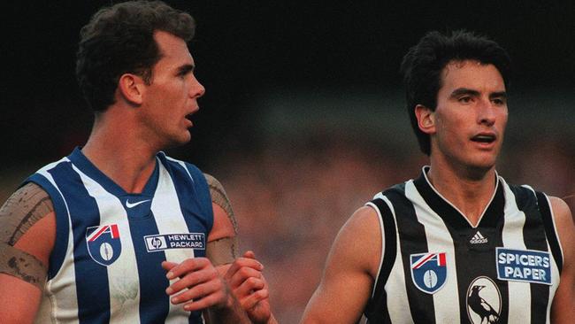 Former Collingwood defender Andrew Schauble opposed to AFL great and North Melbourne champion Wayne Carey in 1996.