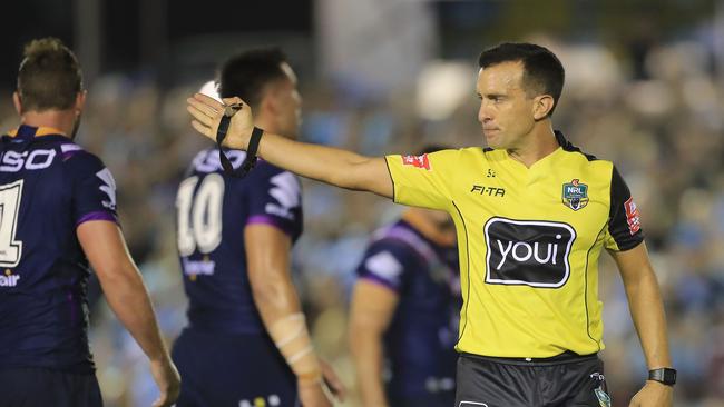 Referee Matt Cecchin blows a penalty in the Sharks v Storm game.