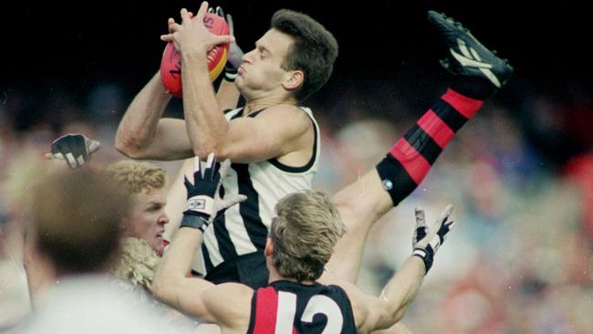 Sav Rocca marks during the 1995 Anzac Day clash.