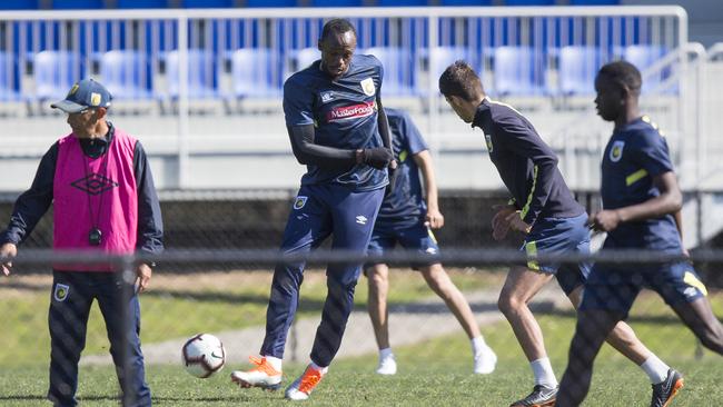 Usain Bolt plays a pass during Central Coast Mariners training on Wednesday. Picture: Dylan Robinson