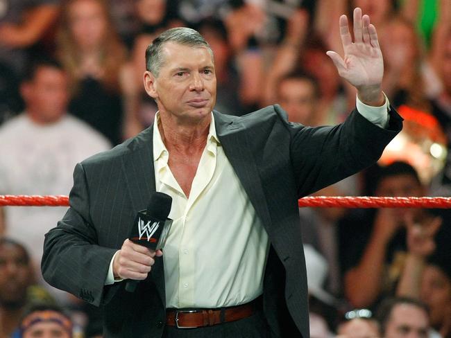 (FILES) In this file photo taken on August 24, 2009 World Wrestling Entertainment Inc. Chairman Vince McMahon appears in the ring during the WWE Monday Night Raw show at the Thomas & Mack Center in Las Vegas, Nevada. - Vince McMahon, the promoter who built a pro wrestling show into a global entertainment empire, Friday announced he was retiring as head of World Wrestling Entertainment -- under a cloud of serious sexual misconduct allegations. McMahon, whose friends include former US president Donald Trump, became a character in his own wrestling promotions at one stage and even launched a rival to the NFL -- his over-the-top XFL. (Photo by Ethan Miller / GETTY IMAGES NORTH AMERICA / AFP)