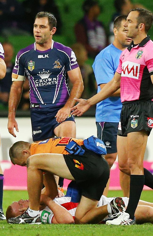 Alex McKinnon lays on the ground after being tackled as Cameron Smith looks on (Photo by Michael Dodge/Getty Images)