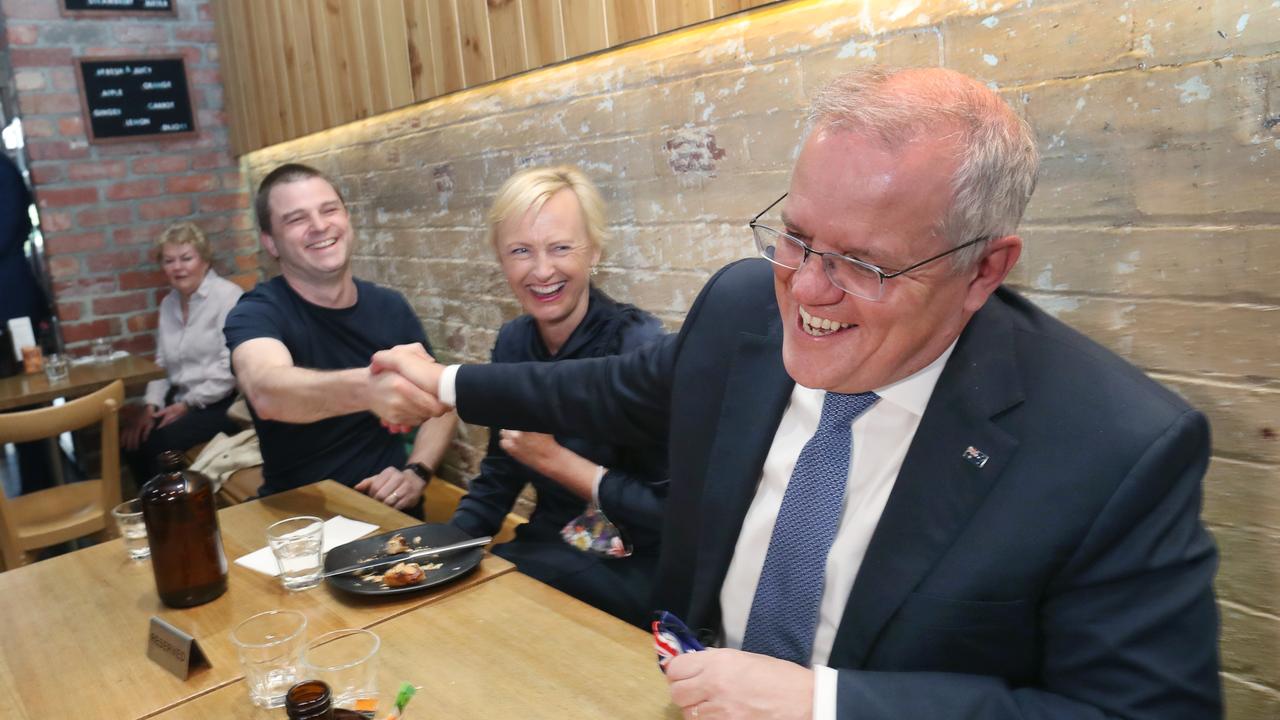 Scott Morrison and Liberal Member for Higgins Katie Allen chat to diners in a Melbourne cafe. Picture: NCA NewsWire / David Crosling