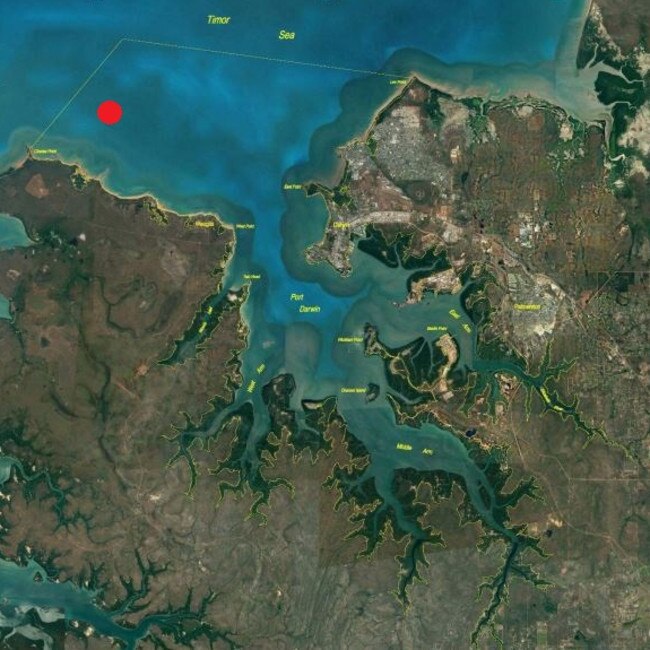 The sailors spent the night clinging to what was left of their 15ft catamaran after it capsized and were found near where the red dot is.