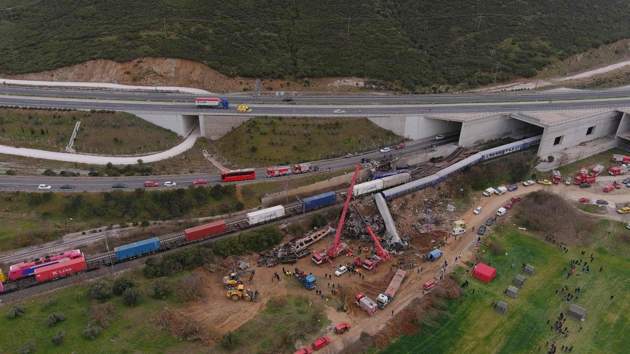 This aerial drone photograph shows emergency crews examining the wreckage after a train accident in the Tempi Valley near Larissa, Greece. Picture: AFP