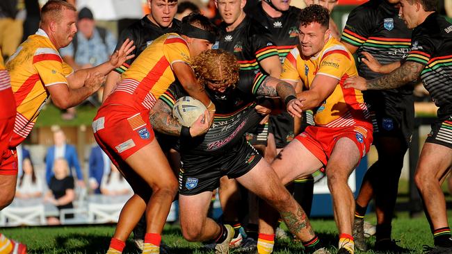 Sawtell fullback Jake Thornton held by the defence. Picture: Leigh Jensen