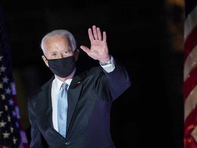 The night before, President-elect Joe Biden waved as he arrived to address the nation. Picture: AFP