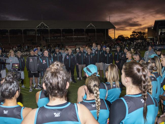 Tom Jonas welcomes the women’s team to the club surrounded by the men’s AFL team. Picture Mark Brake