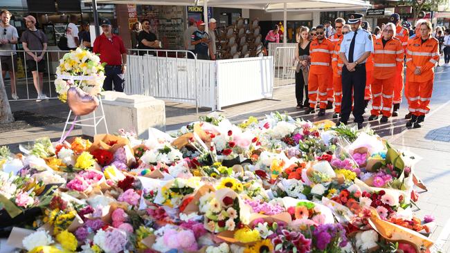 SES pictured after laying flowers at the tribute area at Bondi Junction for the victims of yesterdays stabbing attacks. Picture: Damian Shaw