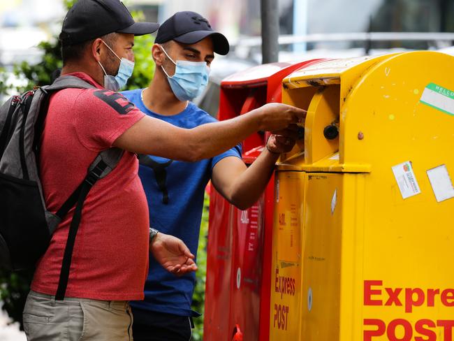 SYDNEY, AUSTRALIA - NewsWire Photos JANUARY, 19, 2021: A view of the main shopping street in Mosman as the locals are living with Covid-19 restrictions and are seen wearing face masks at Australia Post boxes in Sydney, Australia. Picture: NCA NewsWire / Gaye Gerard