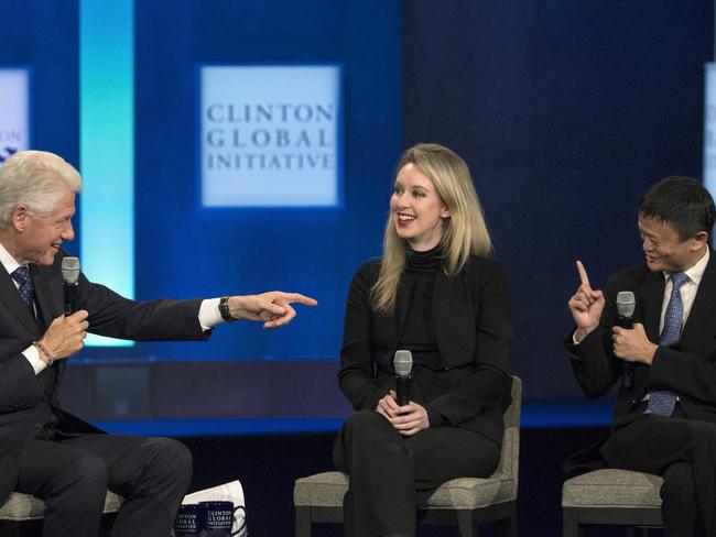 Holmes on stage with former US president Bill Clinton and Jack Ma, executive chairman of Alibaba. Picture: Reuters