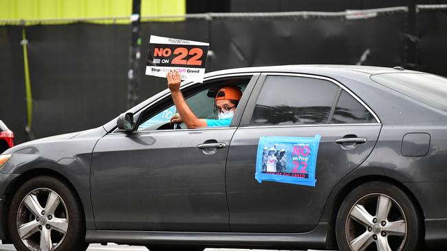 App-based drivers from Uber and Lyft protest in Los Angeles last month, urging voters to reject Proposition 22, which would have classified athem as independent contractors and not employees or agents. Picture: AFP