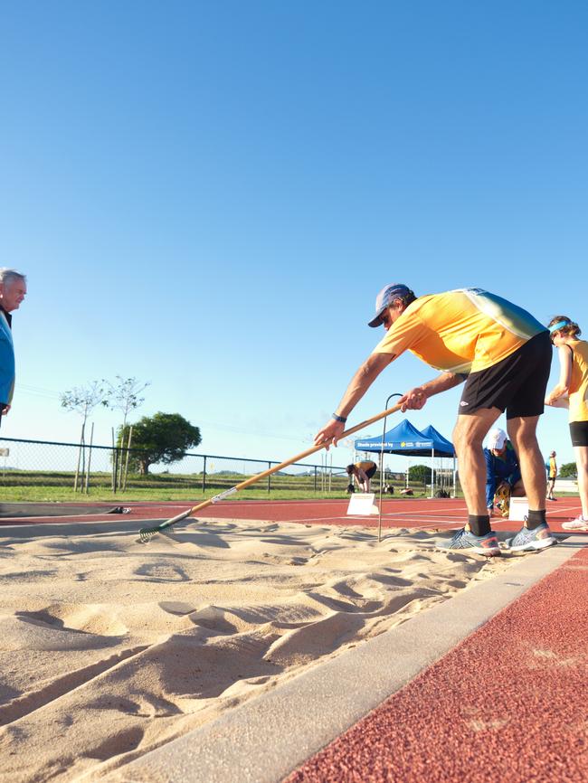 Compete and rake the pit is all part of the sport. Mackay Athletics Summer Series. November 20th, 2021. Picture: Marty Strecker