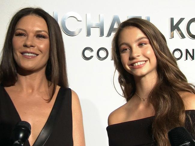 Catherine Zeta-Jones, left, and her daughter Carys Douglas attend the Michael Kors Spring 2018 collection in New York. Picture: AP