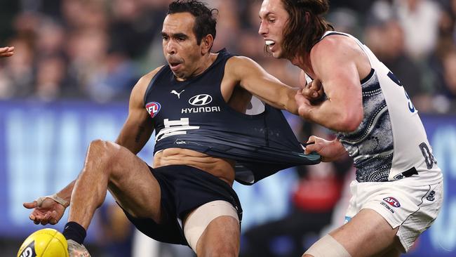 Eddie Betts still manages to get his kick away despite being tackled by Jack Henry. Picture: Michael Klein