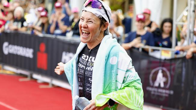 Kylie Simpson crosses the finish line on the Cairns Esplanade to win the Ironman Cairns Asia Pacific Championship race. Picture: Brendan Radke