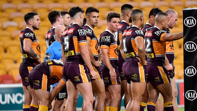 Brodie Croft (centre) of the Broncos is seen with team mates after a Luke Keary of the Roosters scored a try during the Round 4 NRL match the Brisbane Broncos and the Sydney Roosters at Suncorp Stadium in Brisbane, Thursday, June 4, 2020. (AAP Image/Darren England) NO ARCHIVING, EDITORIAL USE ONLY