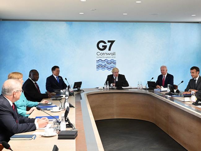 Scott Morrison (L) listens as Joe Biden speaks in a working session at the G7 summit in Carbis Bay, Cornwall. Picture: AFP