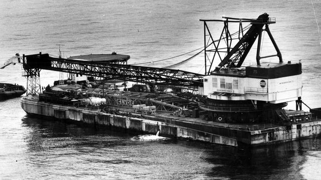 A floating crane is moved into position in 1967 in Bass Strait as the pursuit of oil and gas was stepped up.