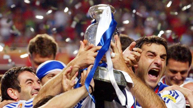 Traianos Dellas holds up the 2004 European Championships trophy with his Greek teammates. Picture: AP