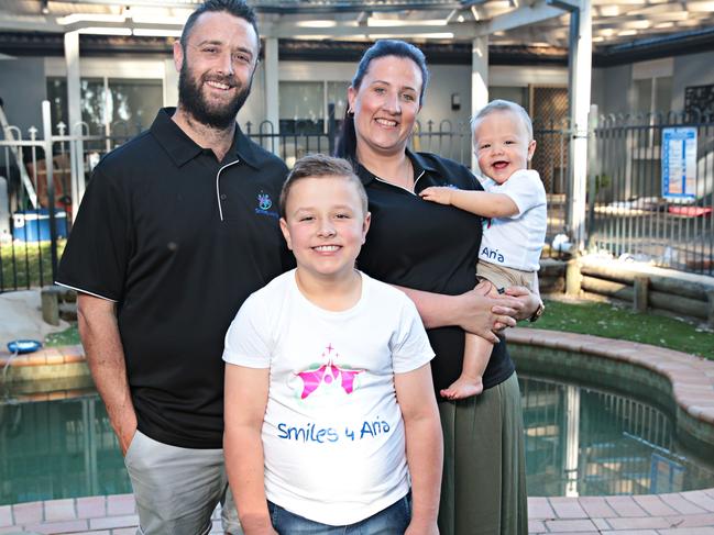 Hollie and Craig Dunn with their sons Jett, eight, and Noah, one, at their home. Picture: Adam Yip