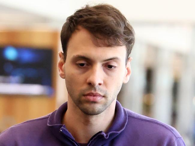 ADELAIDE, AUSTRALIA - NewsWire Photos 17,November, 2023:  Accused attempted murderer Zacharia Josef Bruckner arrives at the Adelaide Airport with police after being extradited from Queensland.  Picture: NCA NewsWire / Kelly Barnes