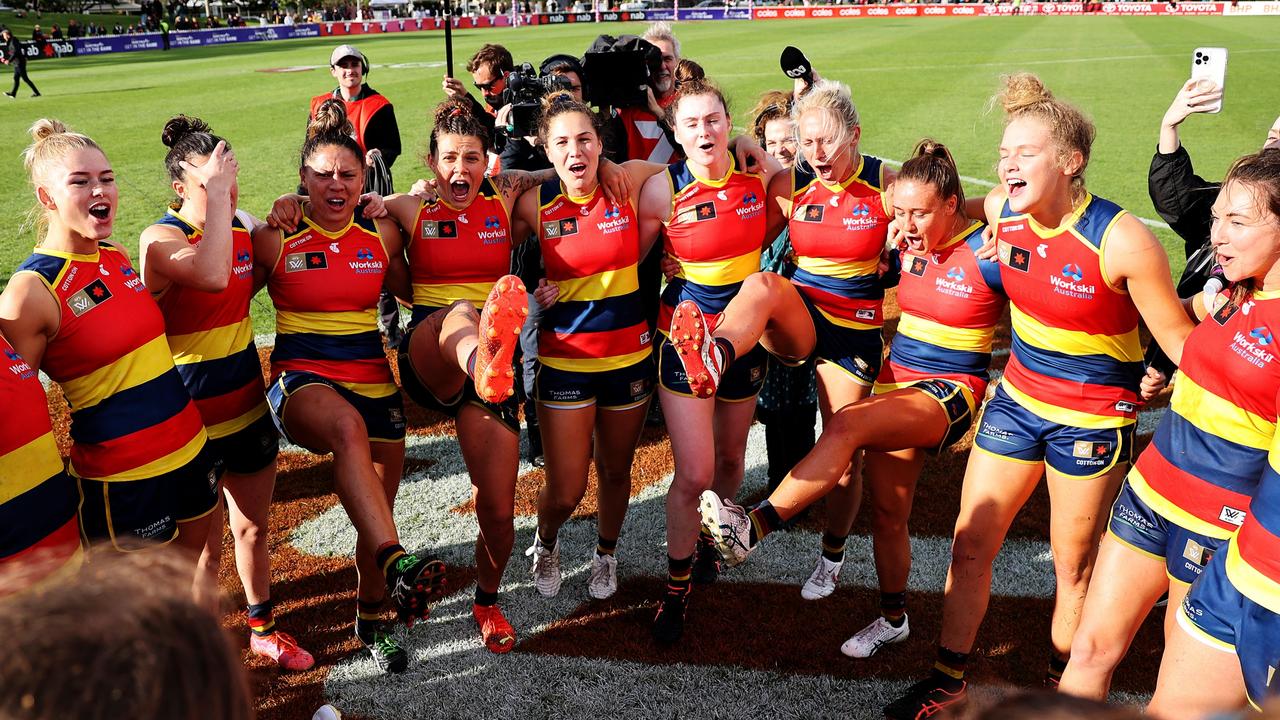 The Crows celebrate their semi-final win to take on Brisbane next in a preliminary final.