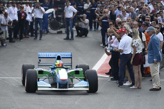 Mick Schumacher, son of seven-time F1 world champion Michael Schumacher,  sits in his car prior to an exhibition lap ahead of the Belgian Formula One  Grand Prix in Spa-Francorchamps, Belgium, Sunday, Aug.