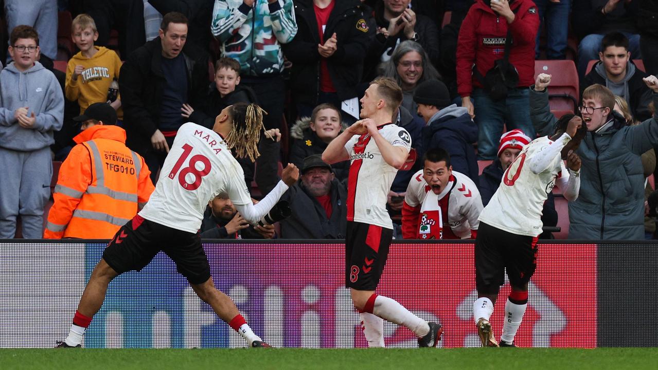 James Ward-Prowse celebrates his stoppage-time equaliser. (Photo by Adrian DENNIS / AFP)