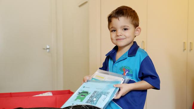 Parramata Park State School grade 1 student Jaxson Briscoe, 5, packing his school bag after home schooling in Parramatta Park. PICTURE: STEWART McLEAN