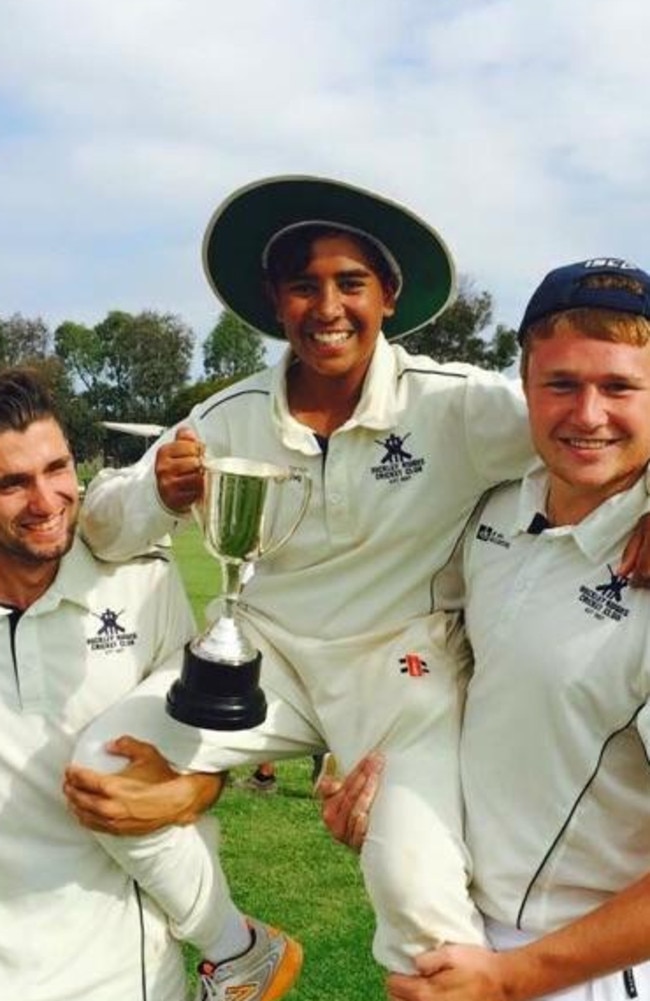 A young Jonathan D’Rozario is carried off with a Turf 3 premiership cup.