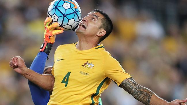 SYDNEY, AUSTRALIA — NOVEMBER 15: Tim Cahill of Australia competes for a header with Donis Escober of Honduras during the 2018 FIFA World Cup Qualifiers Leg 2 match between the Australian Socceroos and Honduras at ANZ Stadium on November 15, 2017 in Sydney, Australia. (Photo by Mark Metcalfe/Getty Images)