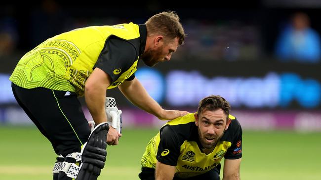 PERTH, AUSTRALIA - OCTOBER 25: Glen Maxwell of Australia reacts after getting hit by the ball as Aaron Finch of Australia checks on him during the ICC Men's T20 World Cup match between Australia and Sri Lanka at Perth Stadium on October 25, 2022 in Perth, Australia. (Photo by James Worsfold/Getty Images)