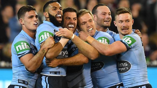 Blues players celebrate a James Tedesco try. Picture: AAP