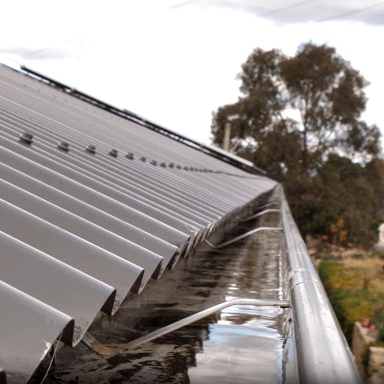 The simple device floods gutters with water to prevent debris catching fire.