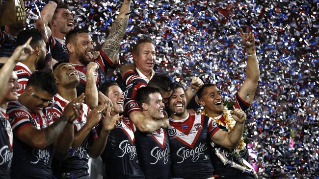 The Roosters celebrate with the 2019 trophy (Photo by Ryan Pierse/Getty Images)