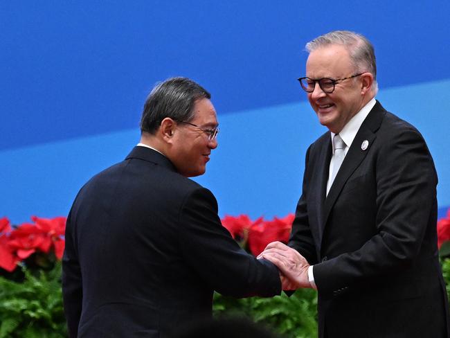 China’s Premier Li Qiang greets Australia’s Prime Minister Anthony Albanese during the China International Import Expo opening session in Shanghai, China, Sunday, November 5, 2023. Anthony Albanese will hold talks in China with President Xi Jinping in the first visit to the Asian nation by a sitting prime minister since 2016. (AAP Image/Lukas Coch) NO ARCHIVING